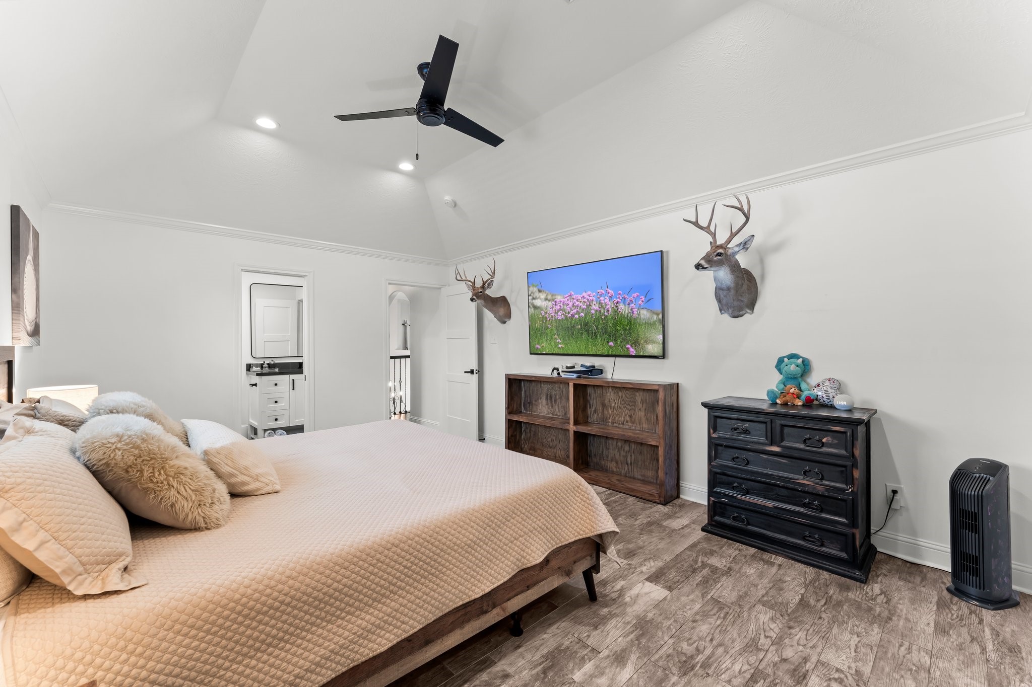 3126 Burton Ridge Drive Spring, TX 77386 - Photo 31 of 41 a bedroom with a bed and a flat screen tv