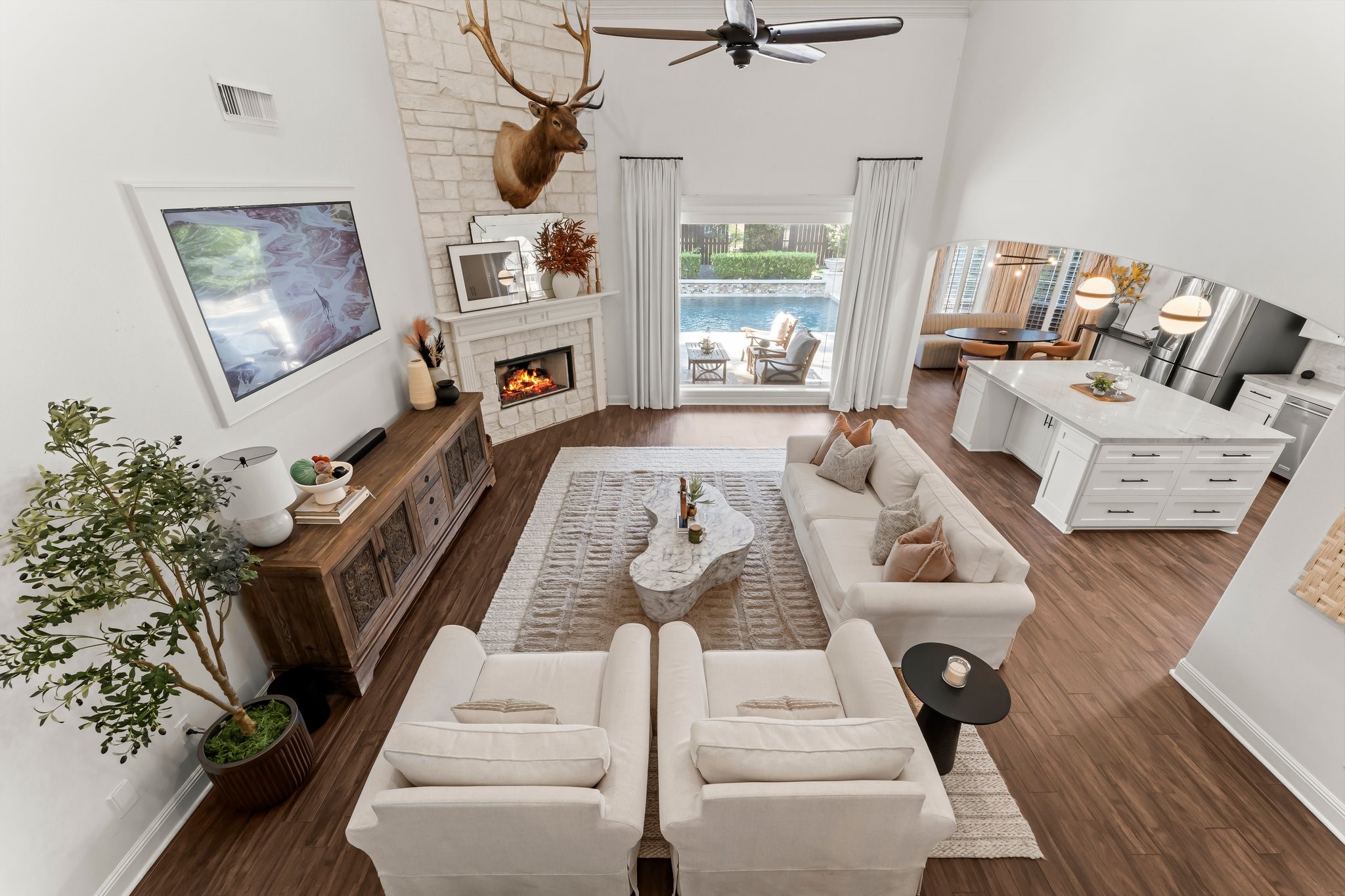 3126 Burton Ridge Drive Spring, TX 77386 - Photo 7 of 41 a living room with furniture floor to ceiling window and potted plant