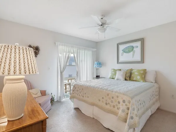 a bedroom with a large bed and a couch