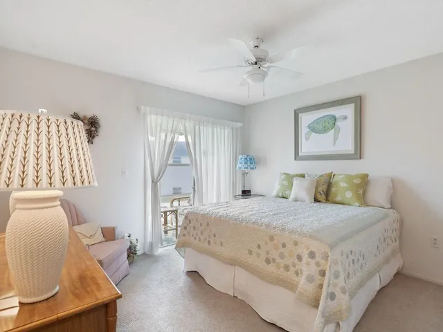 a bedroom with a large bed and a couch