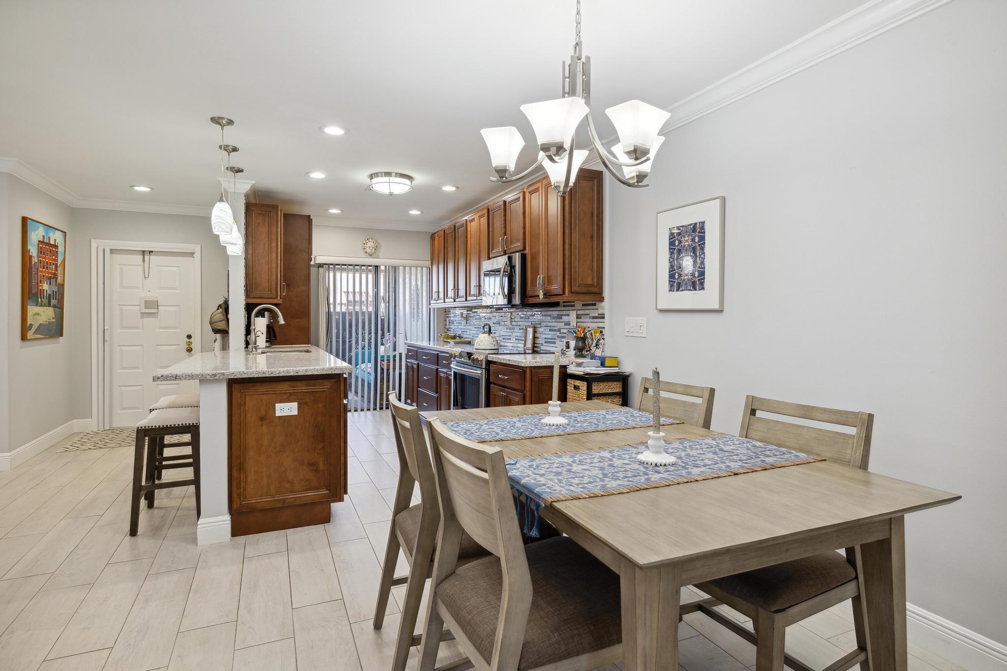5131 Nesting Way, Unit D Delray Beach, FL 33484 - Photo 11 of 24 a view of a dining room with furniture