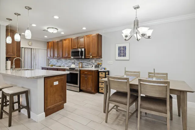 a kitchen with a counter space cabinets and appliances