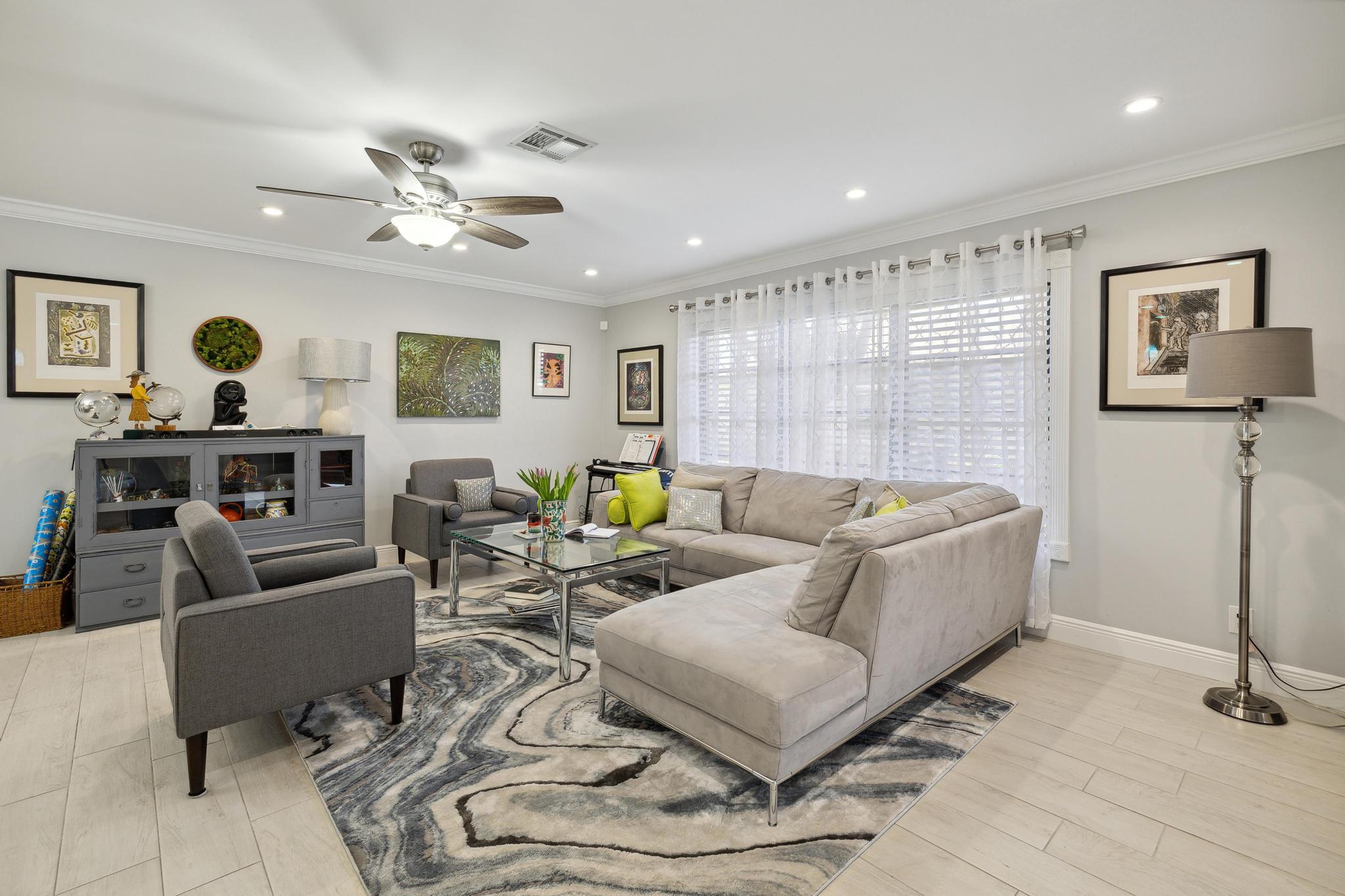 5131 Nesting Way, Unit D Delray Beach, FL 33484 - Photo 3 of 24 a living room with furniture and a table
