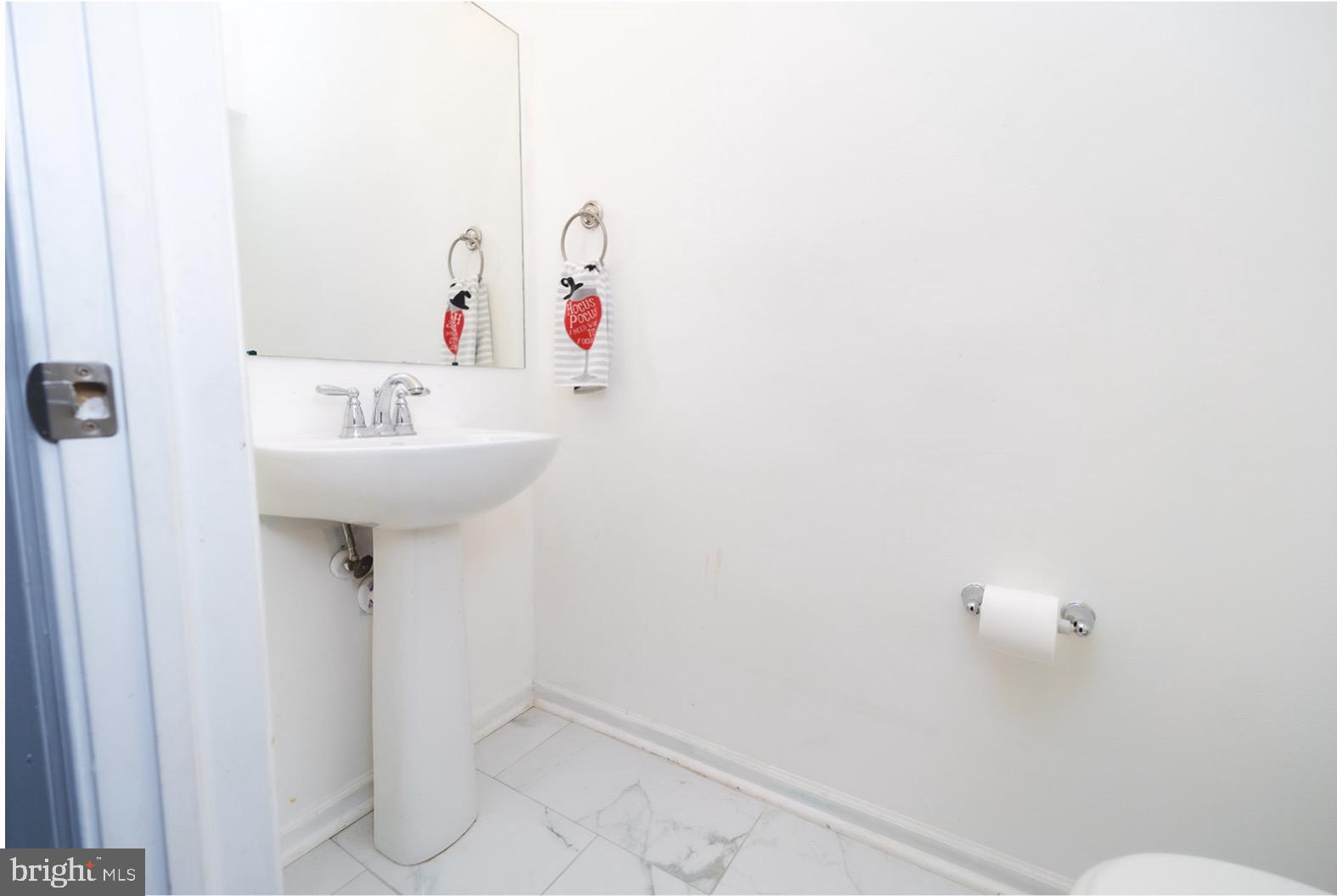 3 Union Street Marcus Hook, PA 19061 - Photo 18 of 23 a bathroom with a sink and mirror