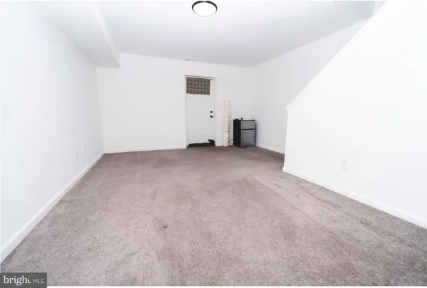 a room with gym equipment and a large window