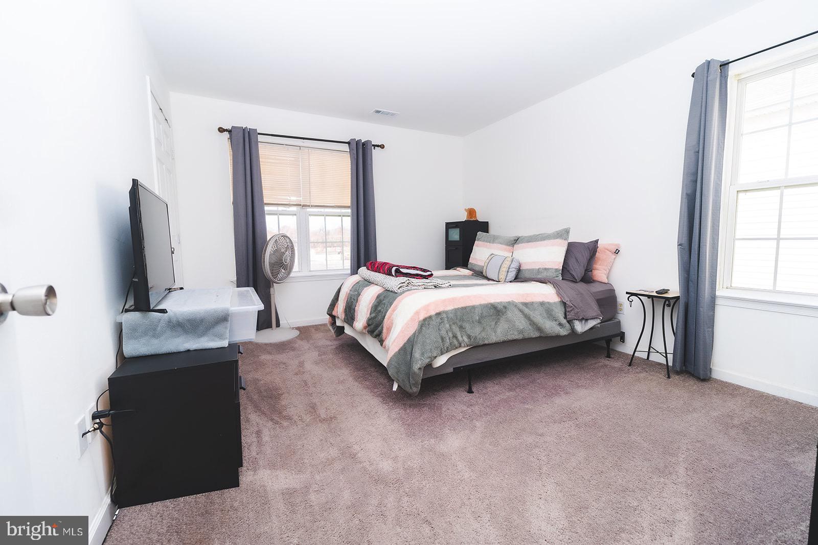 3 Union Street Marcus Hook, PA 19061 - Photo 10 of 23 a spacious bedroom with a bed and window