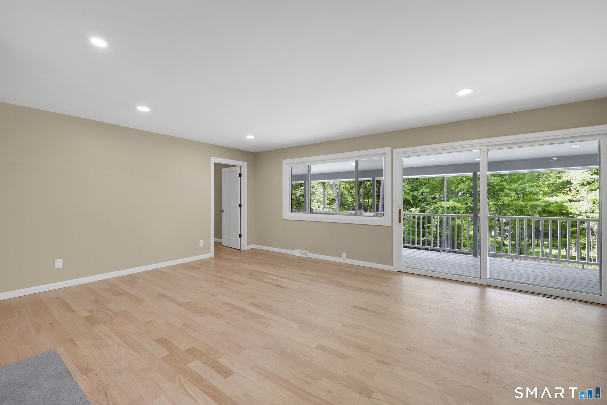 49 Millstone Road Glastonbury, CT 06033 - Photo 10 of 39 a view of an empty room with wooden floor and a window