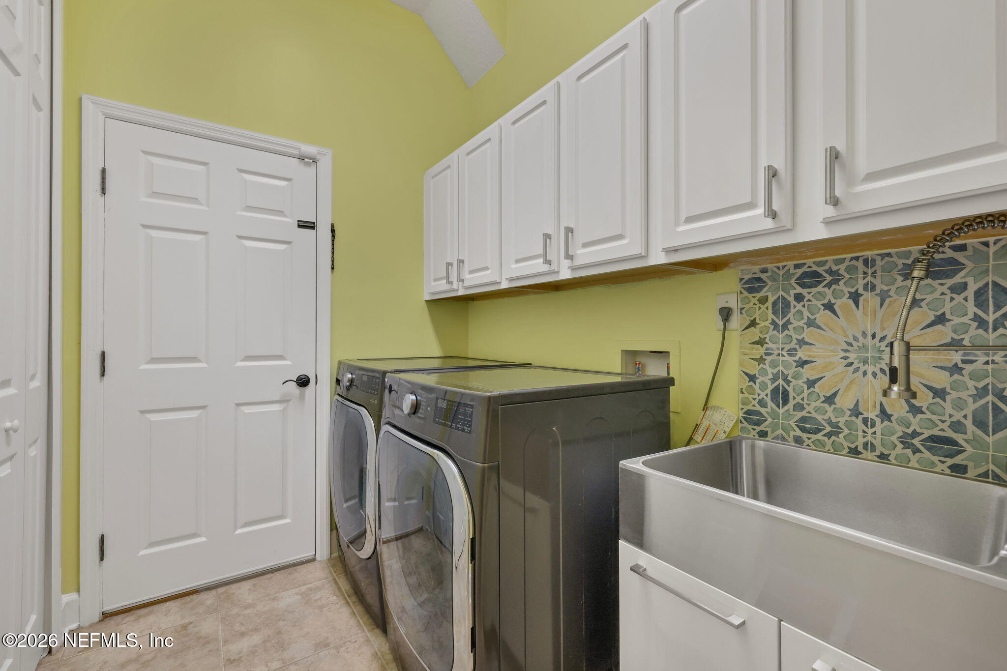 1013 Inverness Drive St. Augustine, FL 32092 - Photo 36 of 65 Laundry with closet, cabinets and sink