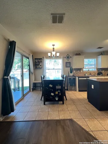 a kitchen with a sink and a large window
