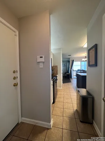 a view of a living room with a refrigerator