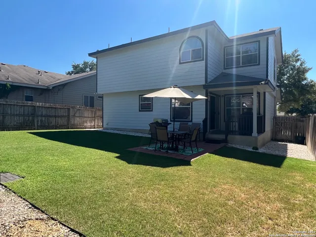 a swimming pool with outdoor seating yard and barbeque oven