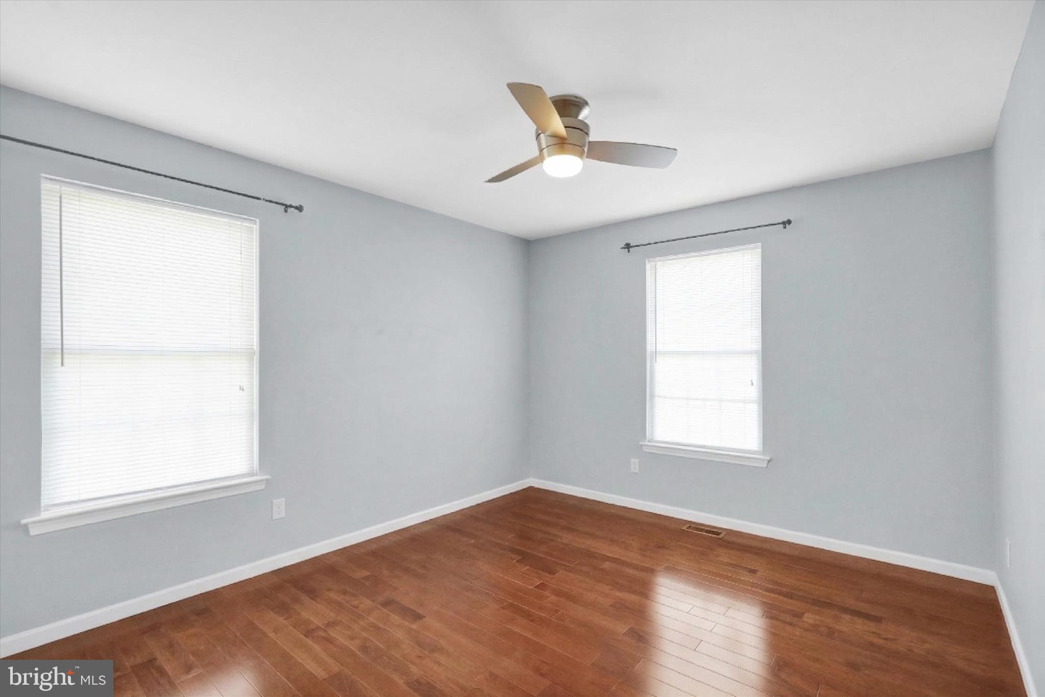 18 Bowes Lane Reading, PA 19606 - Photo 15 of 34 a view of an empty room with wooden floor and a window