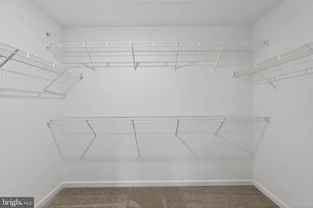a view of a room with racks on the wall
