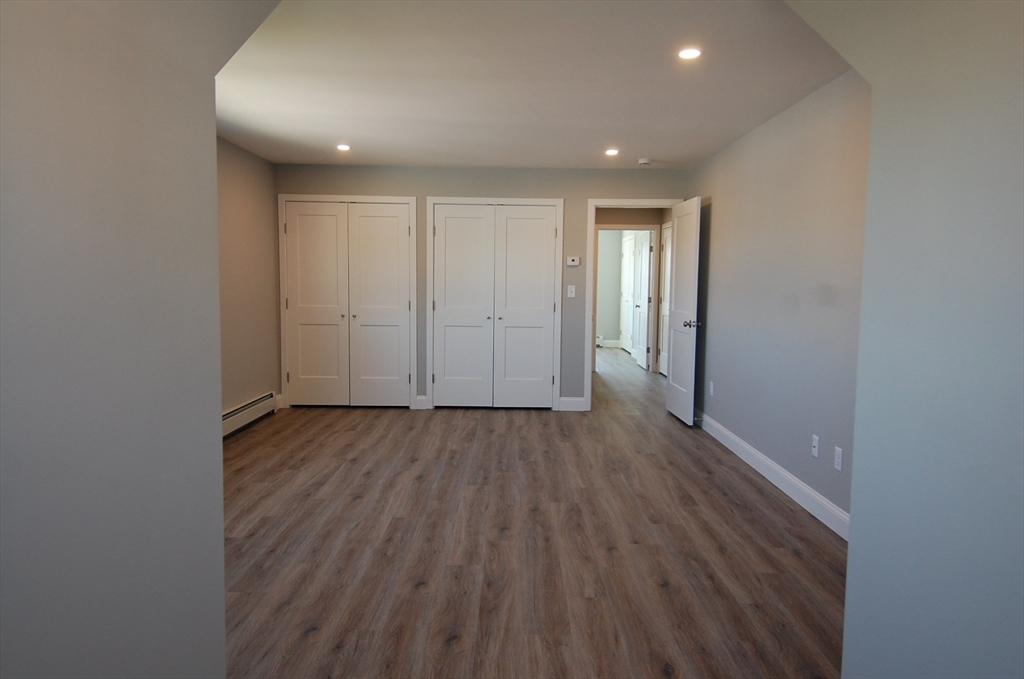 9 Bolton Road, Unit N Dartmouth, MA 02748 - Photo 13 of 19 a view of hallway with wooden floor