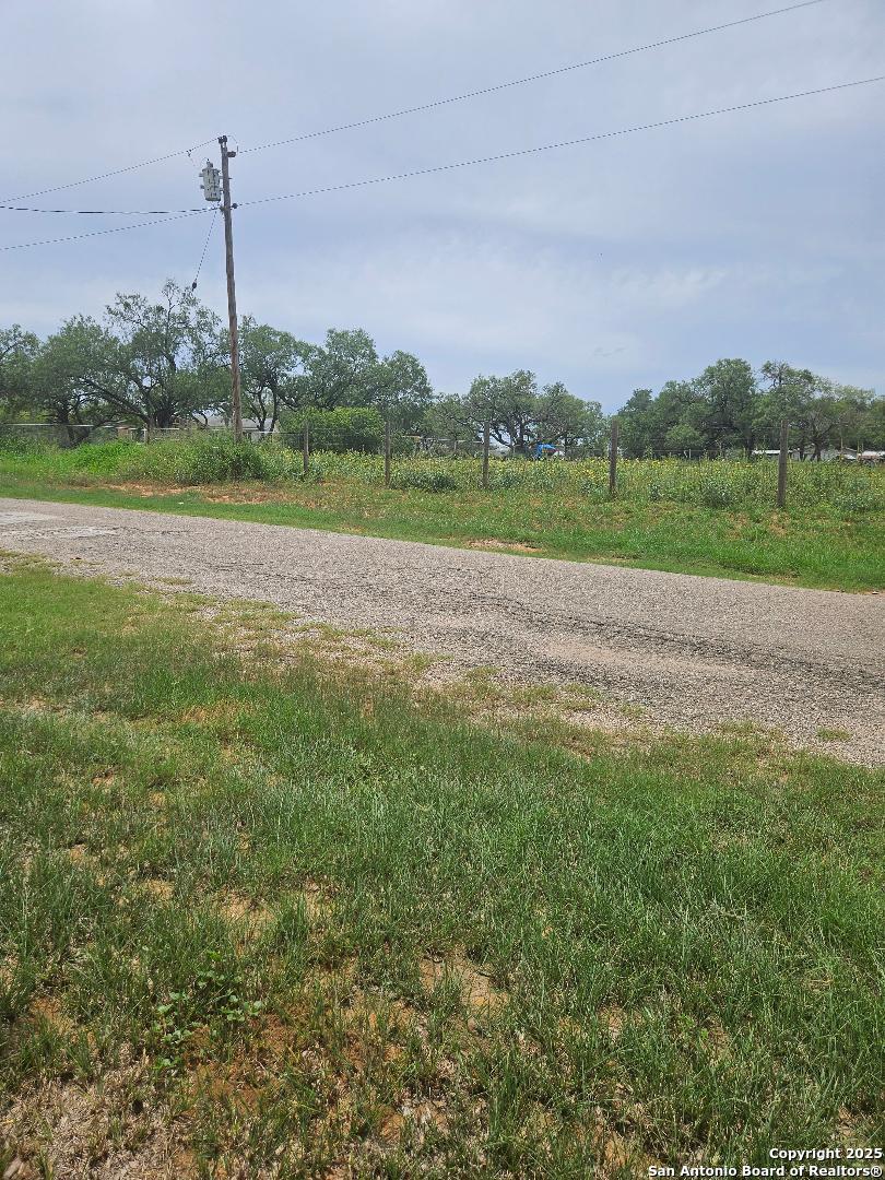 644 County Road 6841 Lytle, TX 78052 - Photo 2 of 3 a view of a green field with clear sky
