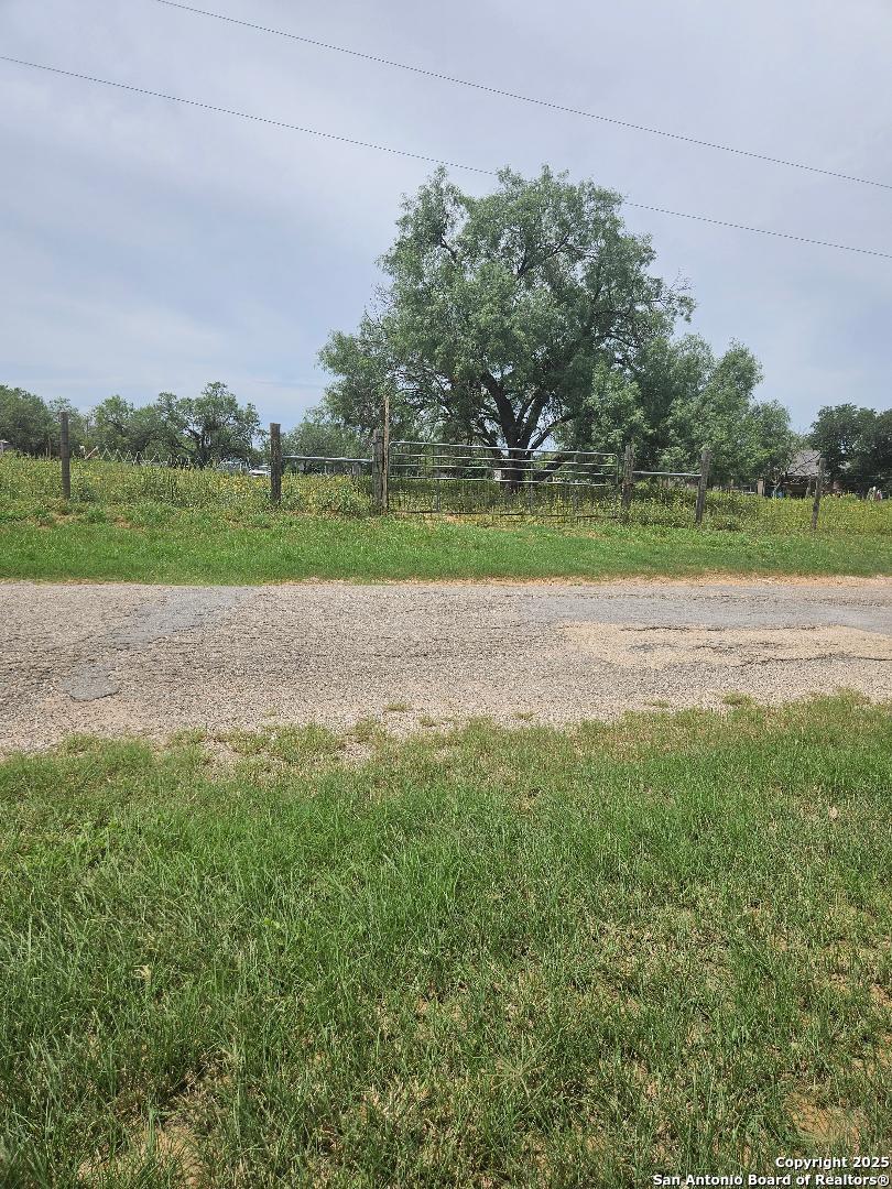 644 County Road 6841 Lytle, TX 78052 - Photo 3 of 3 a view of a golf course with a lake