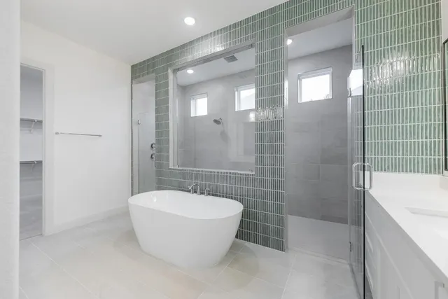 a bathroom with a shower and a sink