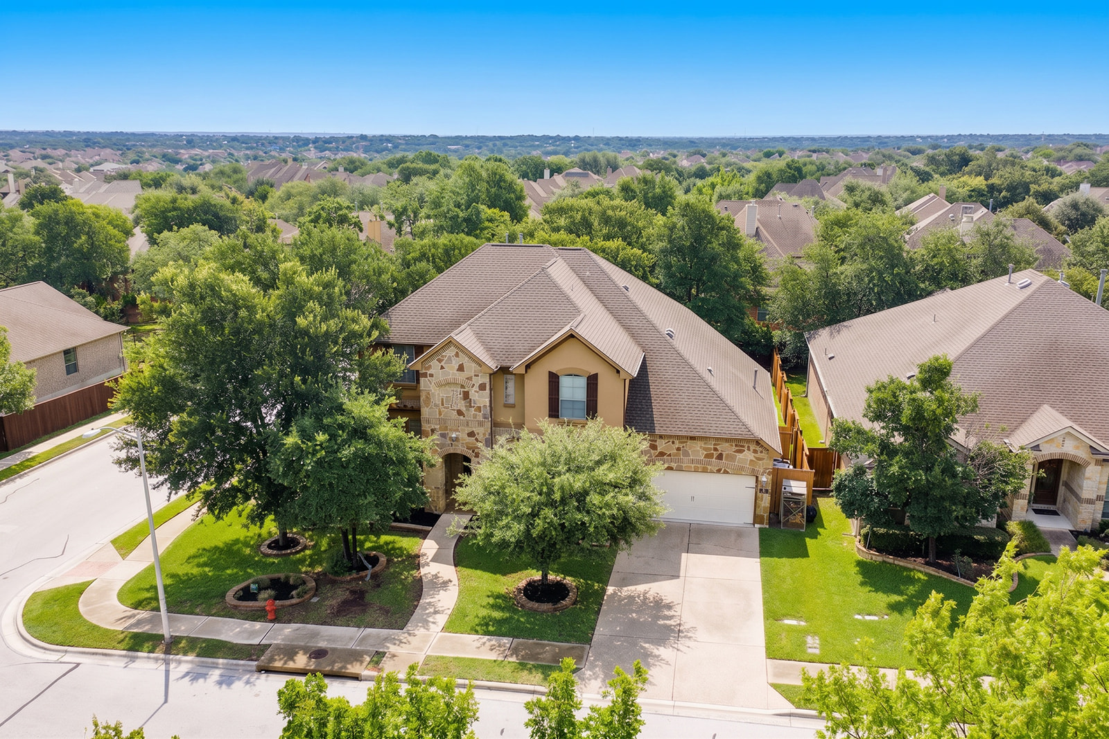114 North Saddle Ridge Drive Cedar Park, TX 78613 - Photo 3 of 40 an aerial view of a house with a garden