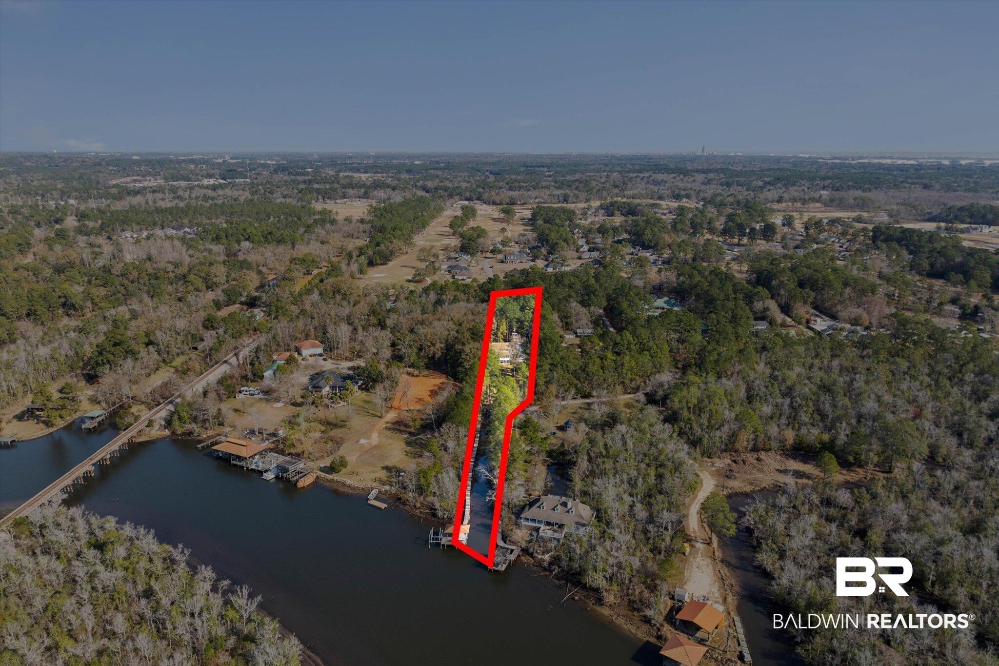 3847 Riviere Du Chien Road Mobile, AL 36693 - Photo 3 of 51 Aerial view of property's location with property parcel outlined and a large body of water