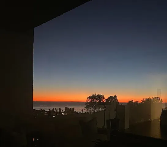 a view of sunset and a yard