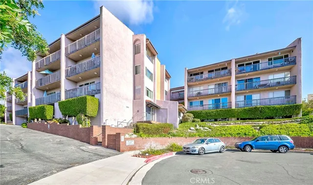 a front view of a building with garden