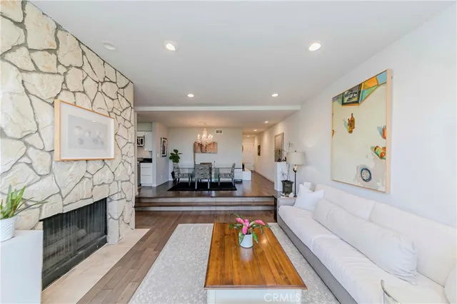 a living room with fireplace furniture and a flat screen tv