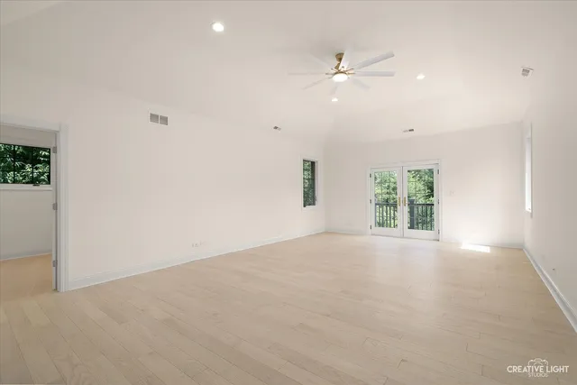a room with pool table and windows