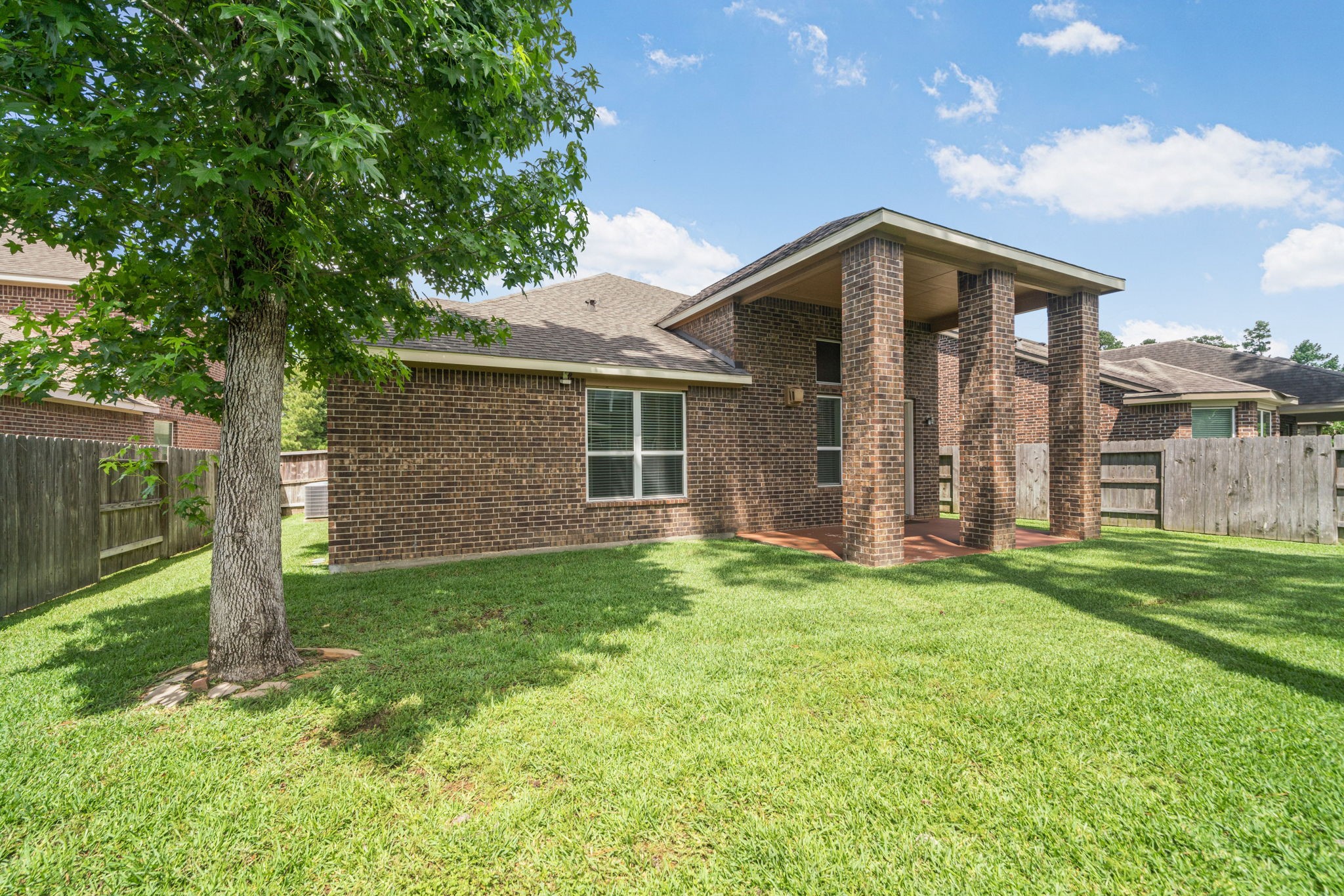 22523 Birch Ridge Meadow Drive Spring, TX 77389 - Photo 35 of 39 a view of a house with a yard