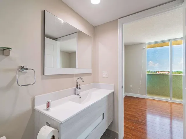 a bathroom with a sink and a mirror