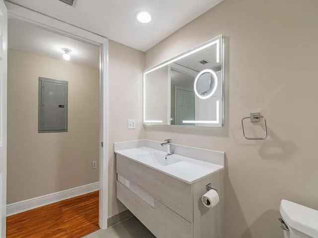 a bathroom with a sink and a mirror