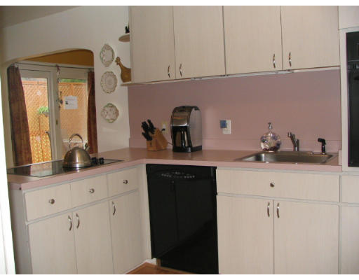 536 Potter Road Framingham, MA 01701 - Photo 7 of 12 a kitchen with cabinets and window