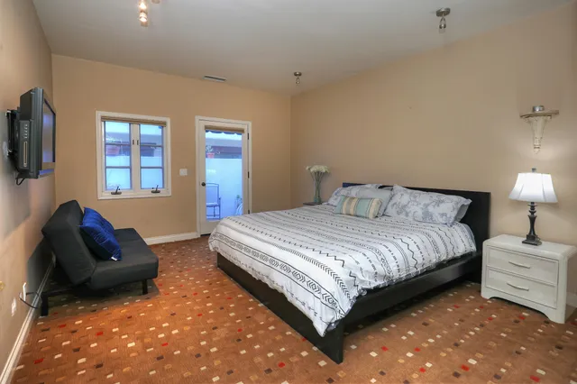 a bedroom with bed and window