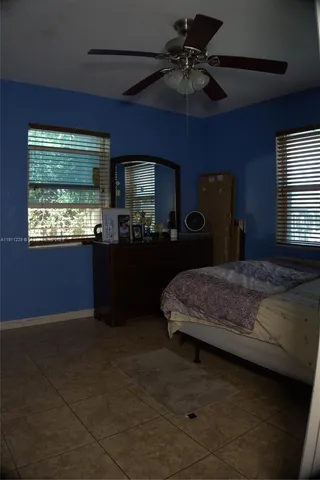 a white toilet sitting next to a shower
