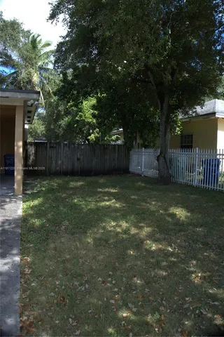 a view of backyard with green space