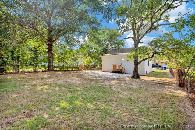 a house view with a backyard space