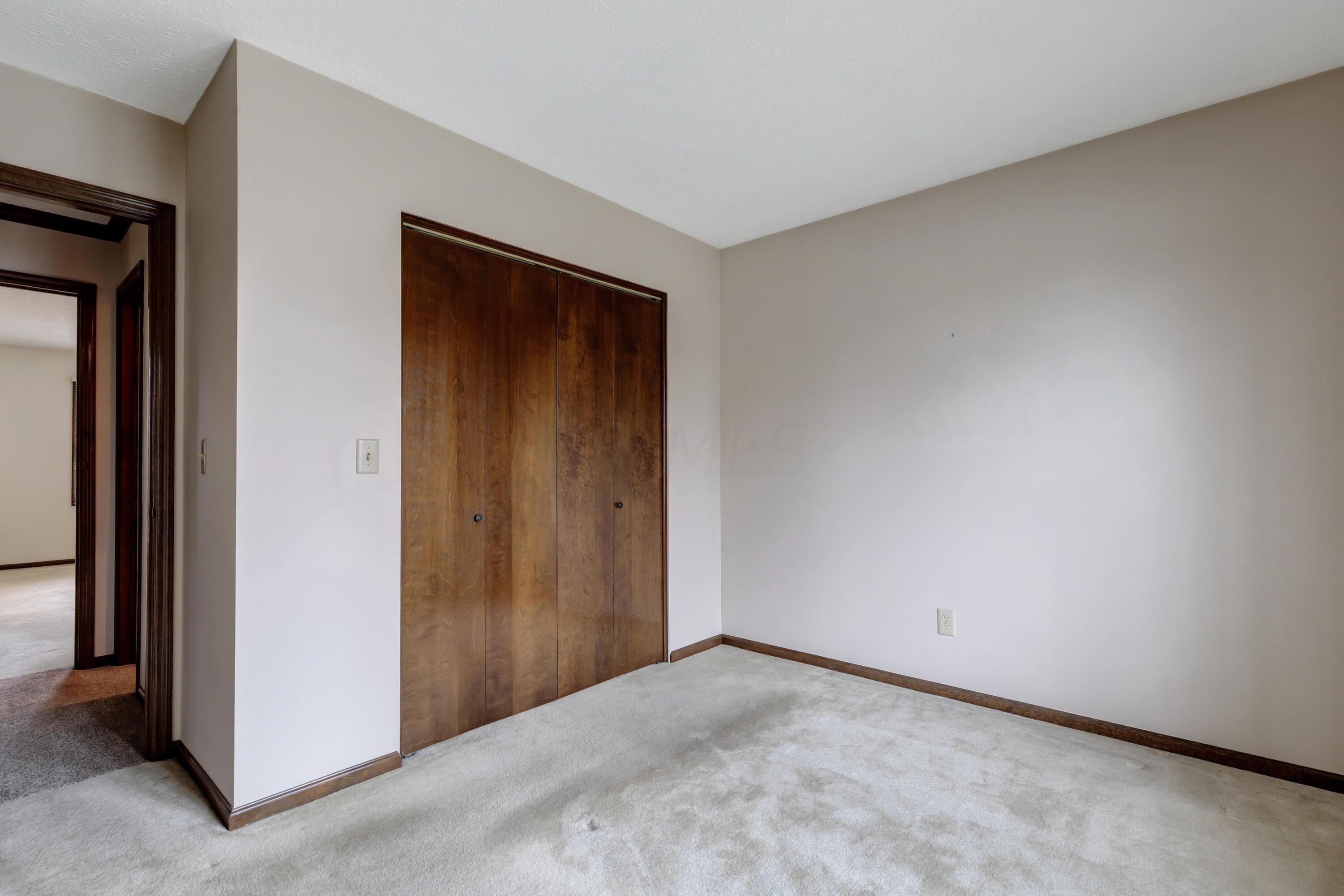 2571 Youngs Grove Road Columbus, OH 43231 - Photo 27 of 40 Bedroom Three-Wood closet doors