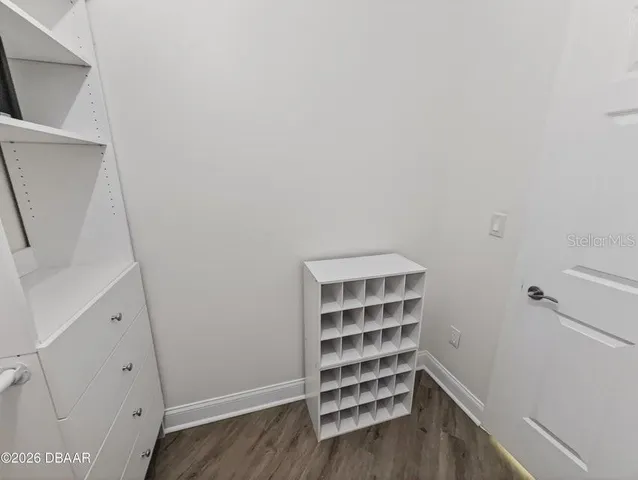 a white toilet sitting next to a shower