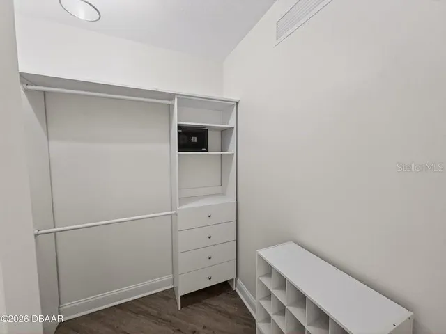 a spacious bathroom with a double vanity sink a mirror and a shower