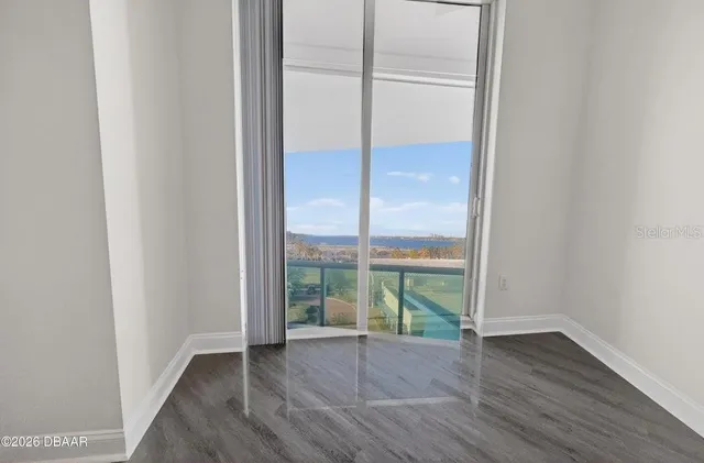a bathroom with a shower sink mirror and toilet