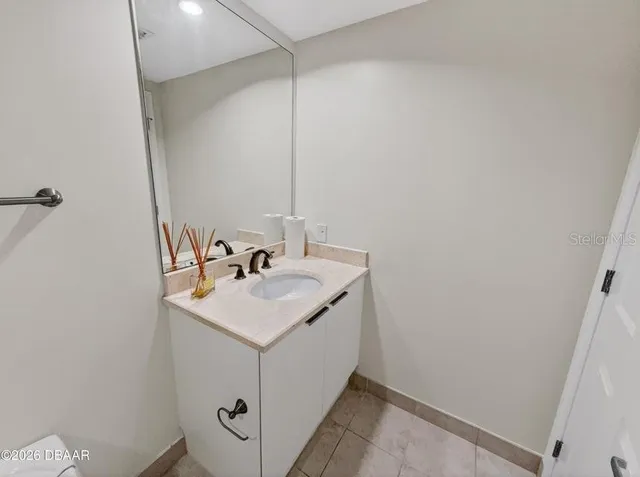 a kitchen with a stove a sink a refrigerator and window