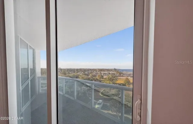 a kitchen with stainless steel appliances granite countertop a refrigerator a stove a sink and a microwave