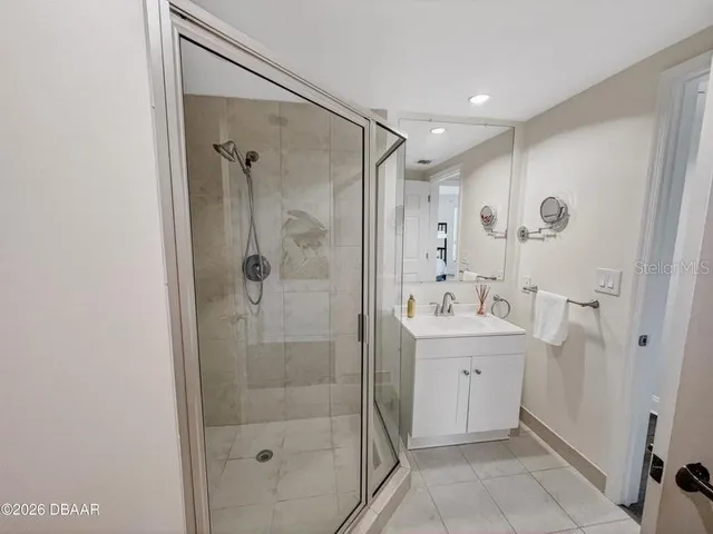 a view of a room with wooden floor and windows