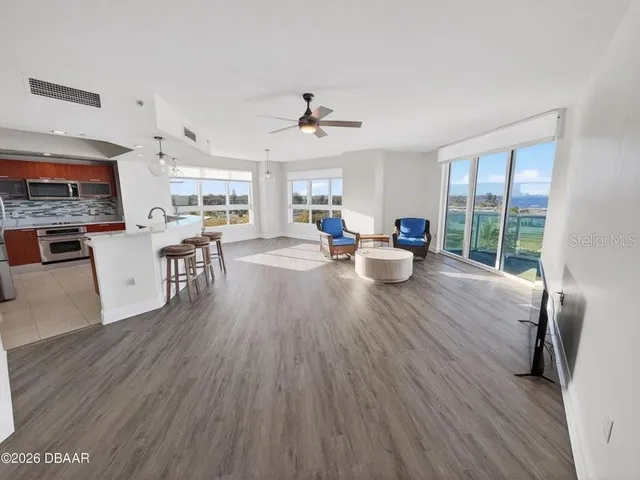 a living room with furniture and a large window