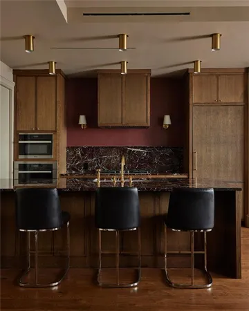 a kitchen with a table and chairs in it