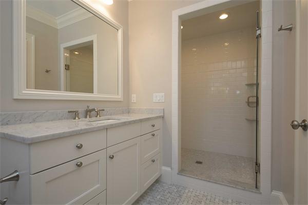 14 Hastings Road Lexington, MA 02421 - Photo 18 of 26 a bathroom with a shower sink and mirror