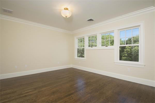 14 Hastings Road Lexington, MA 02421 - Photo 24 of 26 an empty room with wooden floor and windows