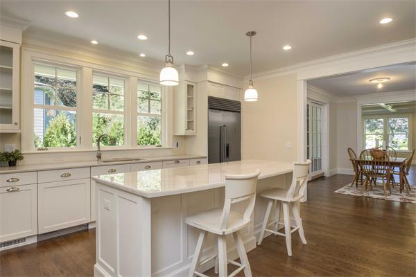 14 Hastings Road Lexington, MA 02421 - Photo 7 of 26 a dining hall with stainless steel appliances granite countertop a sink a stove a dining table and chairs with wooden floor