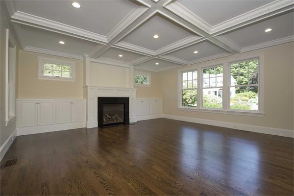 14 Hastings Road Lexington, MA 02421 - Photo 10 of 26 an empty room with wooden floor fireplace and windows