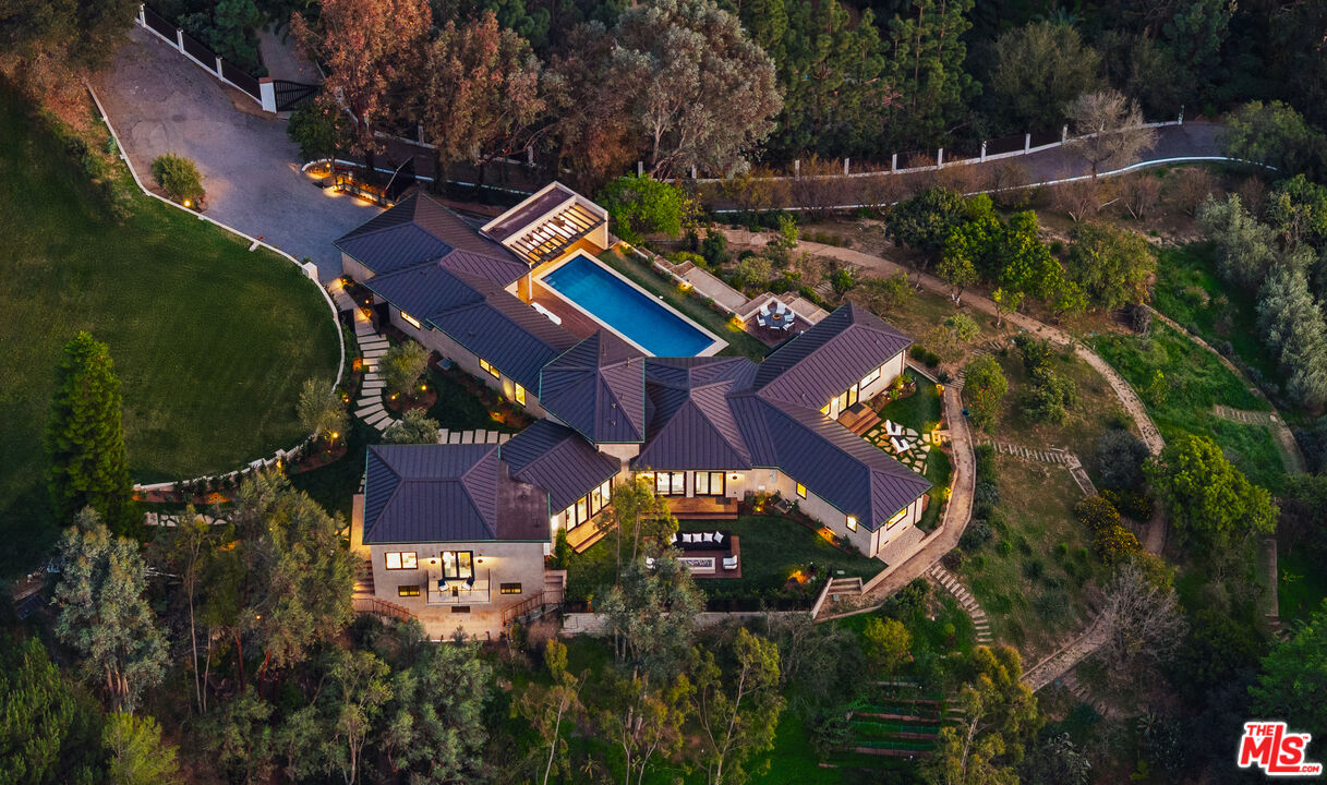 a view of swimming pool with sitting area