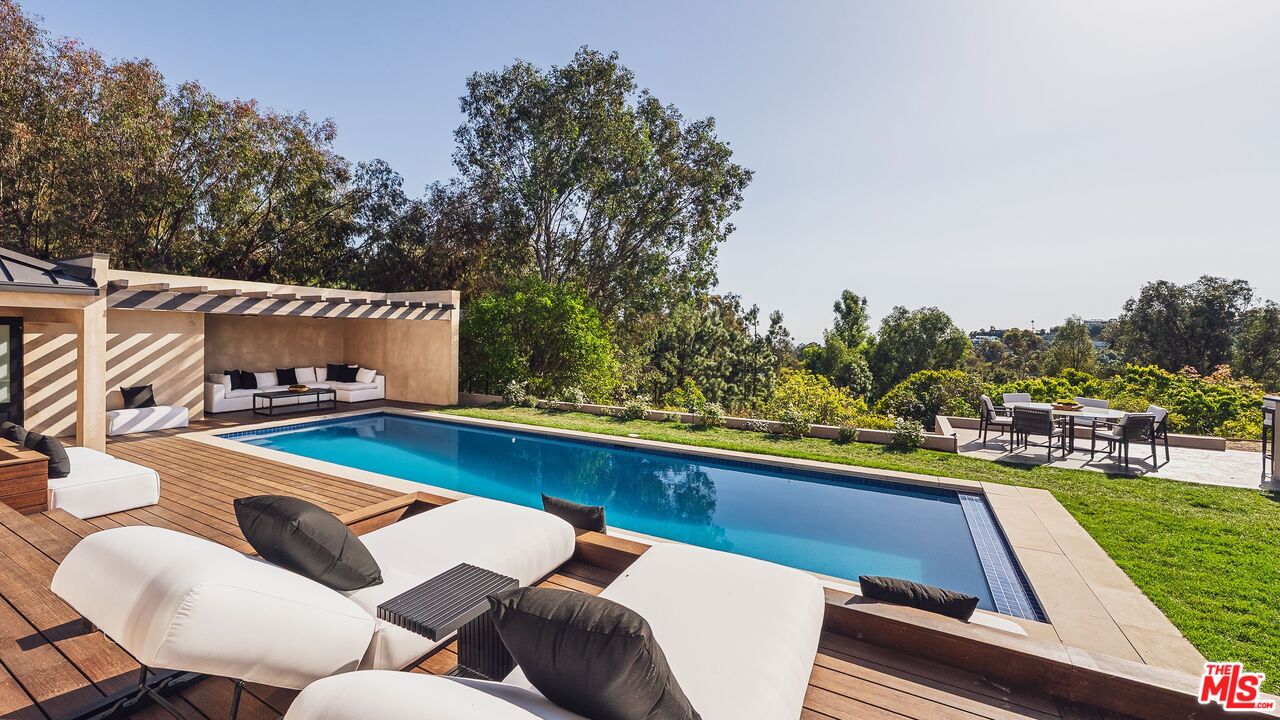 13146 Rivers Road Los Angeles, CA 90049 - Photo 11 of 42 a view of a chairs and table on the roof deck